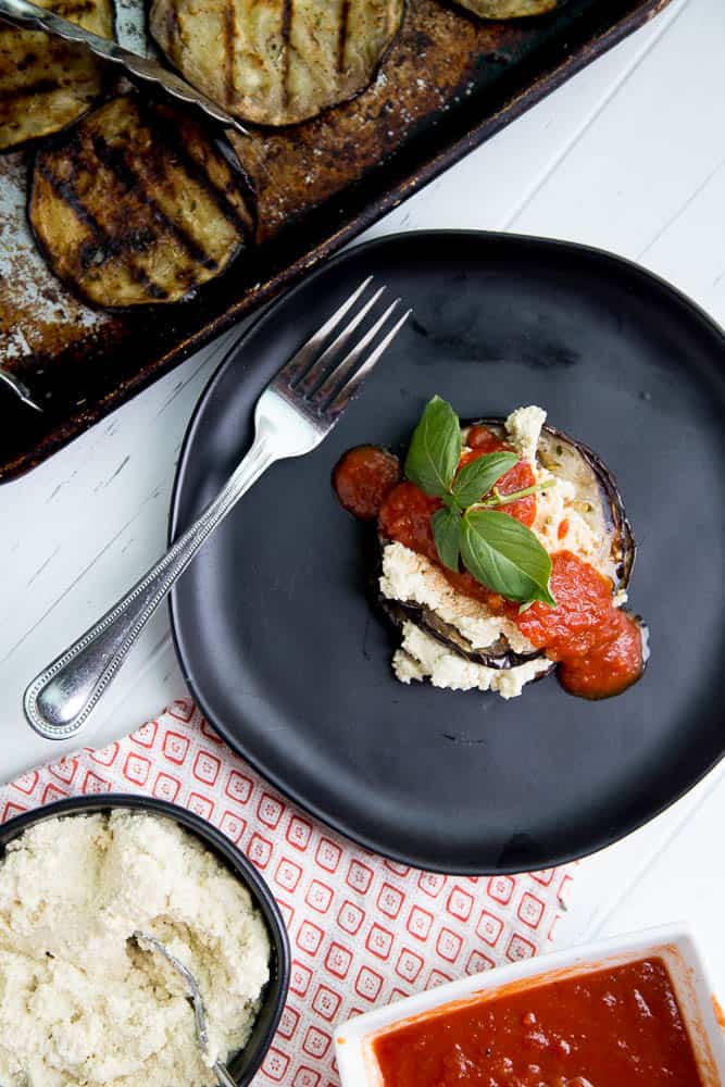 Have you ever tried macadamia ricotta "cheese"? It's hearty, dairy-free alternative to ricotta filled with lots of healthy fats. These Grilled Eggplant Stacks remind me of lasagna, but much less fussy. It's also low-carb and Keto friendly! | perrysplate.com