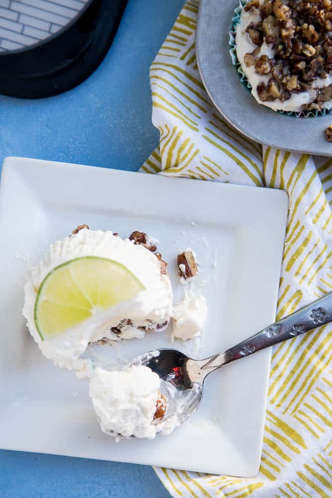 Keto Frozen Key Lime Mini Pies are so easy to make and they can hang out in the freezer and wait until you need them. I love the crumbly candied pecan crust on the bottom! You can make them dairy-free, too. | perrysplate.com 
