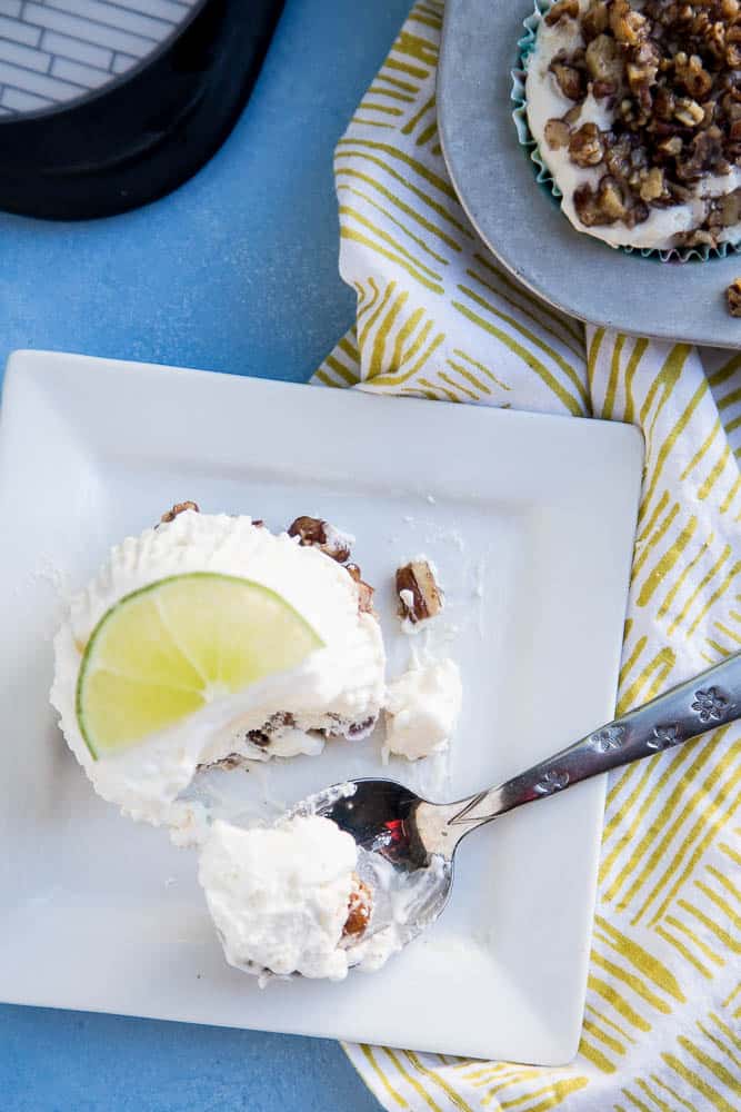 Keto Frozen Key Lime Mini Pies are so easy to make and they can hang out in the freezer and wait until you need them. I love the crumbly candied pecan crust on the bottom! You can make them dairy-free, too. | perrysplate.com