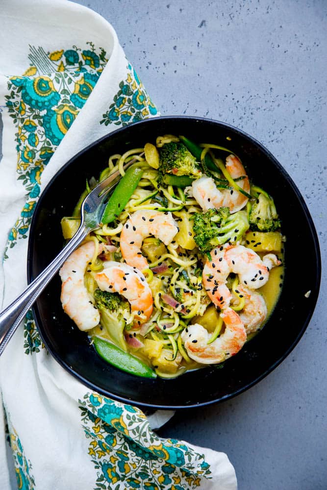 Whip up this easy Thai Green Curry Zoodle dish on a busy weeknight. It's packed with shrimp, green vegetables, and sweet bites of pineapple. Paleo & Whole30 friendly! | perrysplate.com