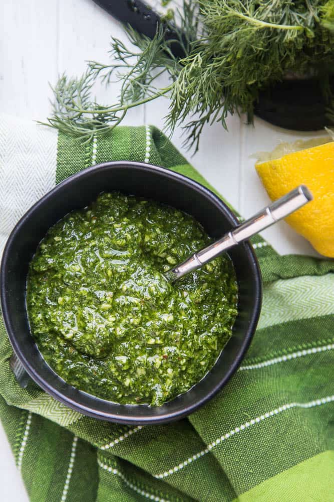 Dairy-Free Dill Pesto is a fun twist on traditional basil pesto. It's perfect to spread over grilled summer vegetables, stir into potato salads, or into some ranch for a super dill-infused salad dressing! | perrysplate.com | paleo recipes | keto recipes | Whole30 recipes
