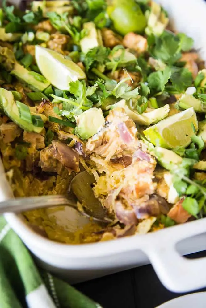 Green Chile Chicken & Spaghetti Squash Bake | This keto/Whole30 friendly spaghetti squash bake is PERFECT for meal preppers or those who like to prep components of a meal ahead of time. I love the addition of green salsa and a splash of paleo ranch to give it some creaminess. Avocados on top are a must! | PerrysPlate.com