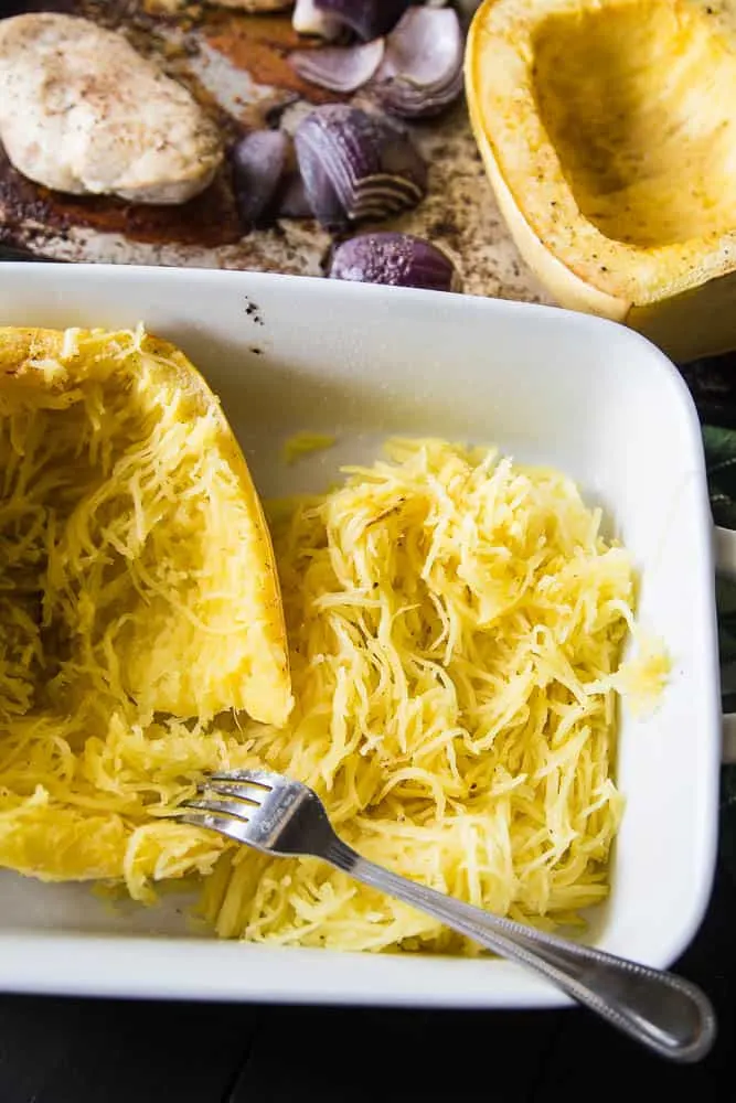 Green Chile Chicken & Spaghetti Squash Bake | This keto/Whole30 friendly spaghetti squash bake is PERFECT for meal preppers or those who like to prep components of a meal ahead of time. I love the addition of green salsa and a splash of paleo ranch to give it some creaminess. Avocados on top are a must! | PerrysPlate.com