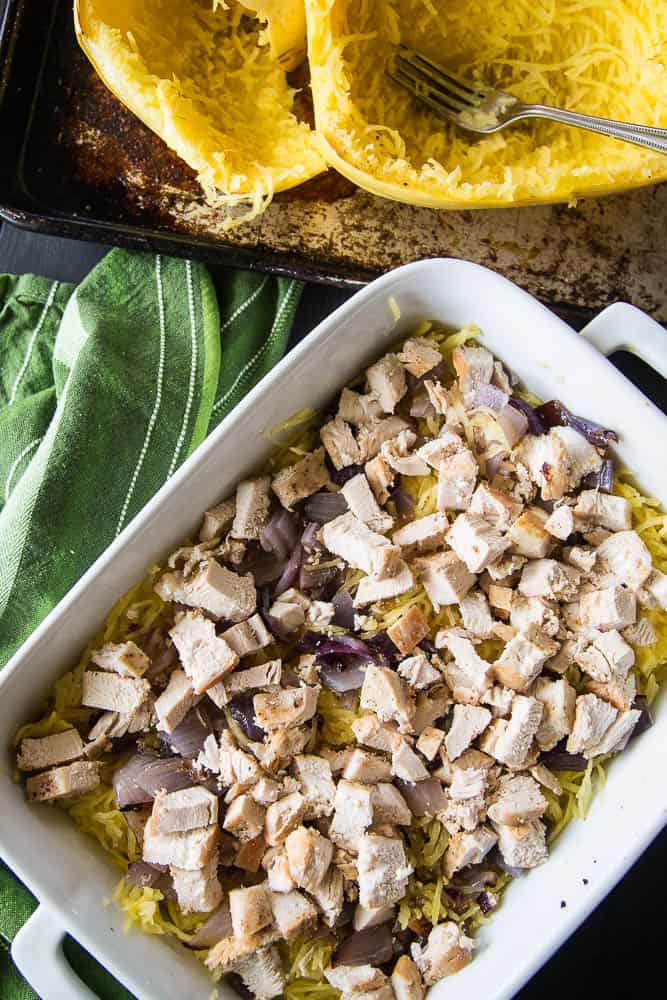 Green Chile Chicken & Spaghetti Squash Bake | This keto/Whole30 friendly spaghetti squash bake is PERFECT for meal preppers or those who like to prep components of a meal ahead of time. I love the addition of green salsa and a splash of paleo ranch to give it some creaminess. Avocados on top are a must! | PerrysPlate.com
