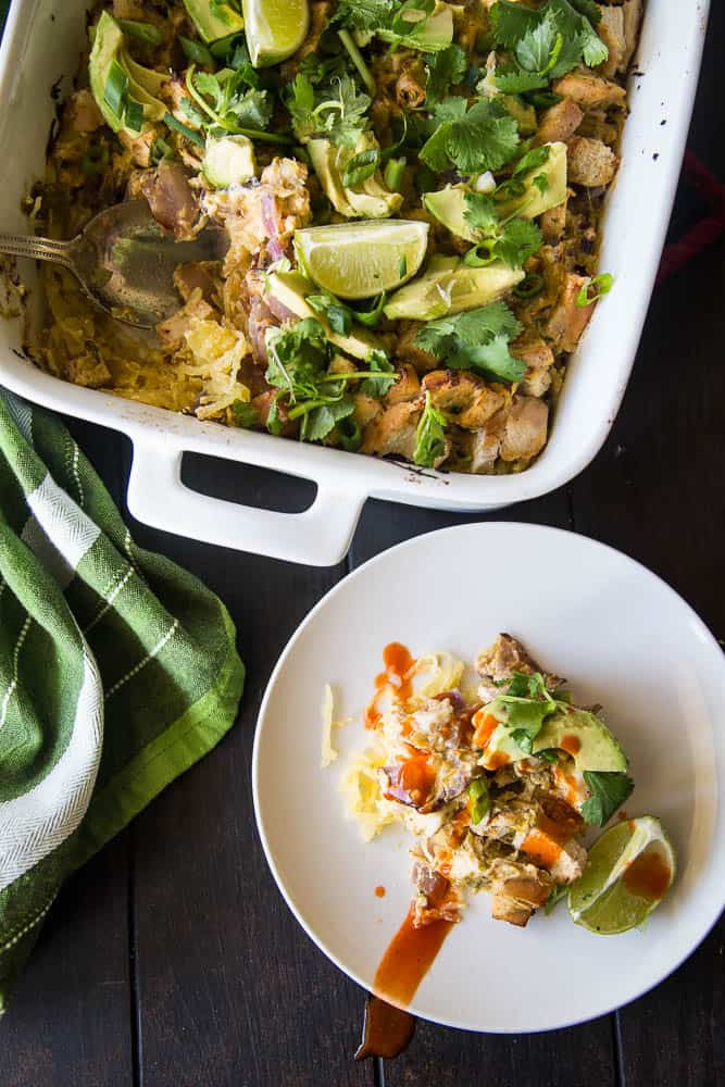 Green Chile Chicken & Spaghetti Squash Bake | This keto/Whole30 friendly spaghetti squash bake is PERFECT for meal preppers or those who like to prep components of a meal ahead of time. I love the addition of green salsa and a splash of paleo ranch to give it some creaminess. Avocados on top are a must! | PerrysPlate.com