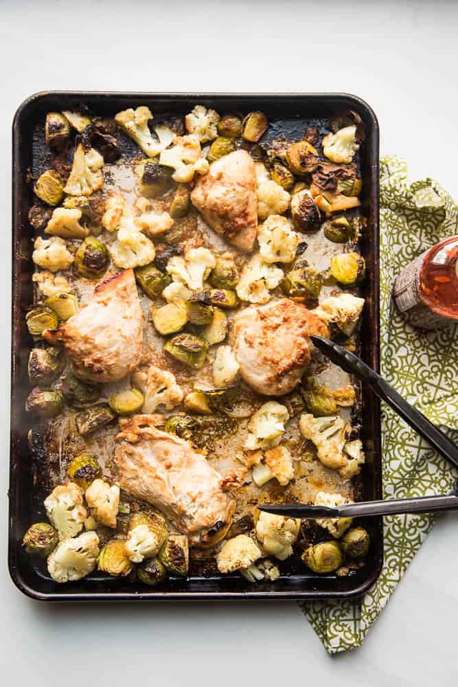 This pan dinner is your best friend -- especially on the weeknights. This sheet pan BFF has chicken & veggies that cook up in a super easy Thai-inspired marinade. You can serve it as is (Paleo/Keto/Whole30 friendly!) or with some freshly steamed Jasmine rice. | PerrysPlate.com