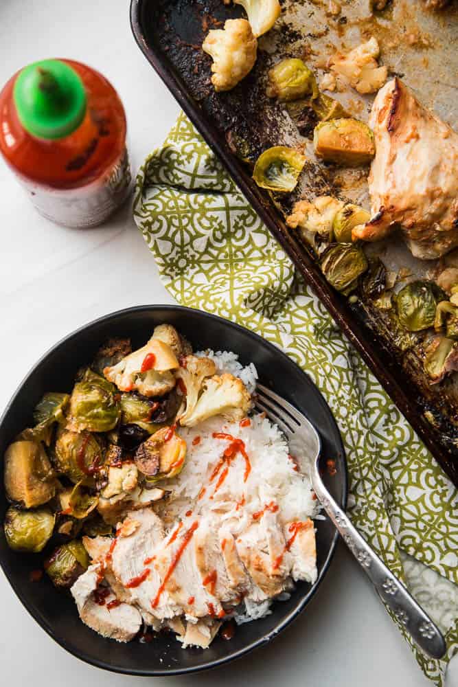 A sheet pan dinner is your best friend -- especially on the weeknights. This sheet pan BFF has chicken & veggies that cook up in a super easy Thai-inspired marinade. You can serve it as is (Paleo/Keto/Whole30 friendly!) or with some freshly steamed Jasmine rice. | PerrysPlate.com