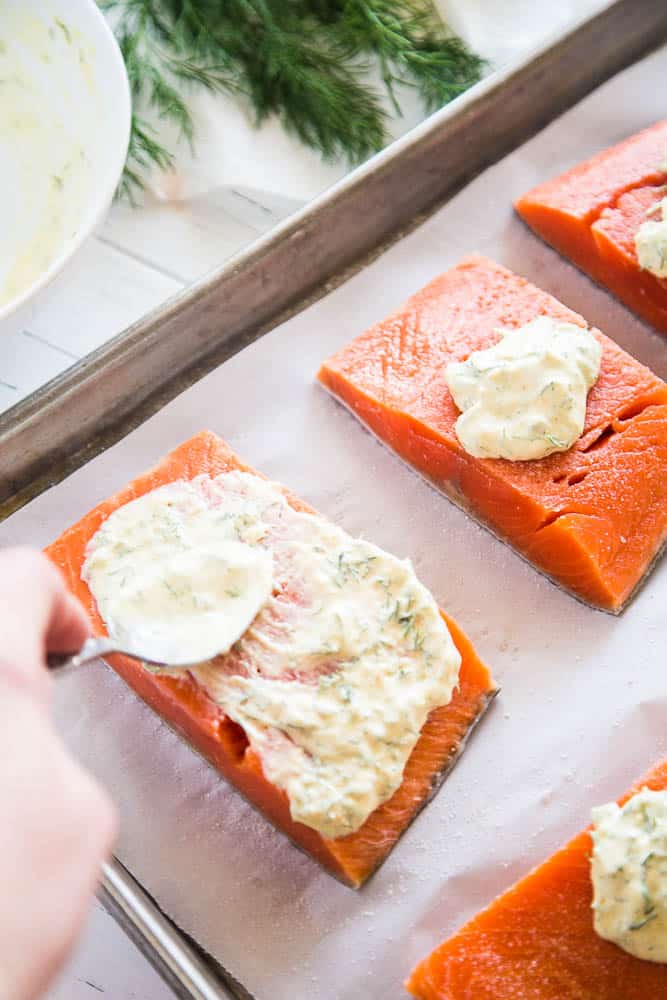 This is an EASY meal that is ready in under 30 minutes! My kids loved this Creamy Garlic & Dill Roasted Salmon -- even the ones who don't like salmon. It's also paleo, low-carb/keto, and Whole30 friendly! | perrysplate.com #salmonrecipes #30minutedinners #ketorecipes