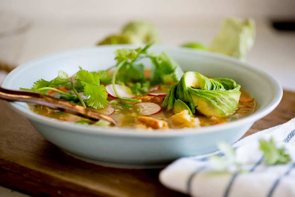 This Instant Pot Chicken Tomatillo Soup is perfect all year round! It's a perfect #paleo, #keto, or #Whole30recipe. Just don't skimp on the avocados! | perrysplate.com