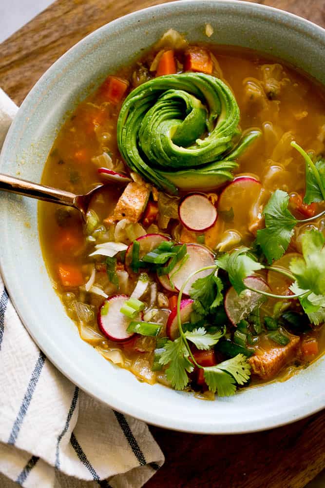 This Instant Pot Chicken Tomatillo Soup is perfect all year round! It's a perfect #paleo, #keto, or #Whole30recipe. Just don't skimp on the avocados! | perrysplate.com