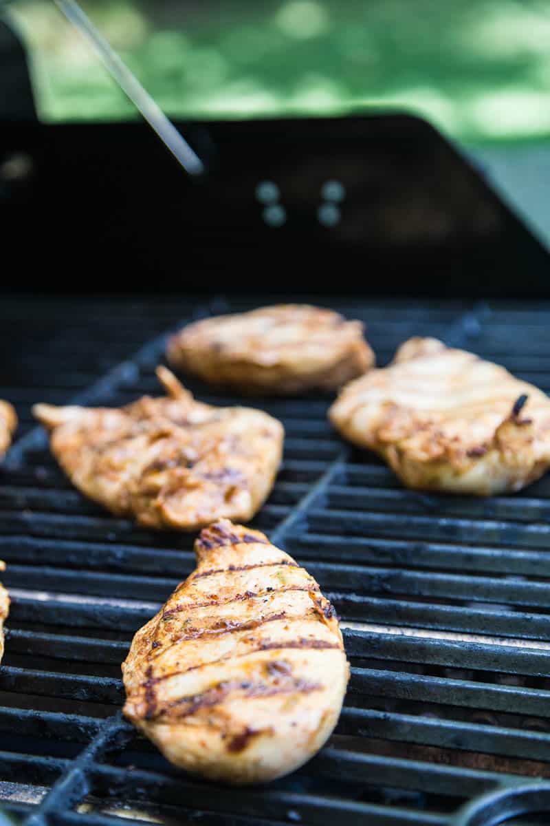 Chipotle-Lime Grilled Chicken with Strawberry Mango Salsa might be my favorite meal of the summer. It's easy to throw the chicken into a marinade ahead of time, and the kids all loved it! | perrysplate.com #grilledchicken #mangosalsa #summerrecipes