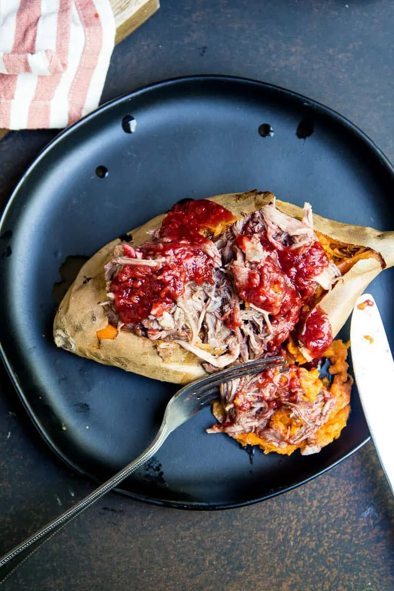 BBQ Pulled Pork is SO easy in an Instant Pot pressure cooker! You can turn a big pork roast into tender shreds of sweet BBQ in under 2 hours! | perrysplate.com #instantpot #bbqpulledpork