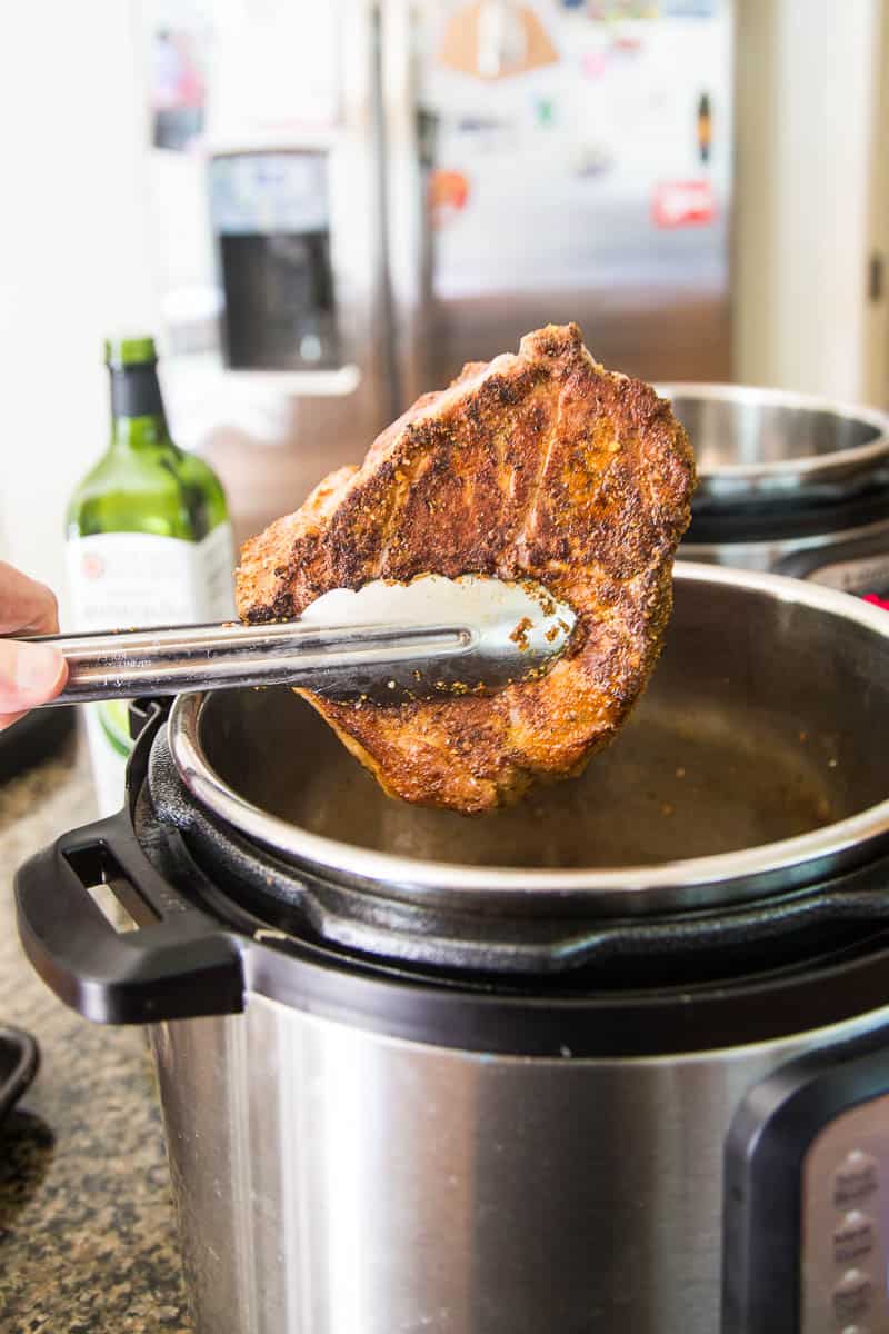 BBQ Pulled Pork is SO easy in an Instant Pot pressure cooker! You can turn a big pork roast into tender shreds of sweet BBQ in under 2 hours! | perrysplate.com #instantpot #bbqpulledpork