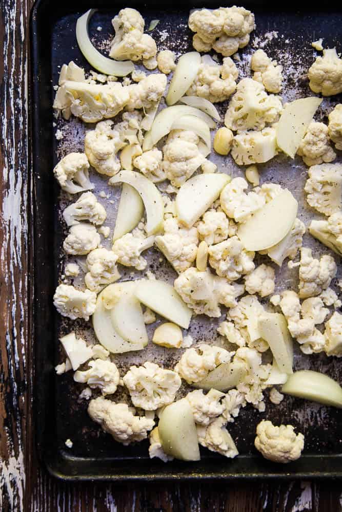 Cheesy Keto Roasted Cauliflower Soup only has a handful of ingredients and is a great recipe for meal prep or a busy weeknight! It's easily made Whole30 and paleo friendly, too! | perrysplate.com #ketorecipes #ketosoup #lowcarbrecipes