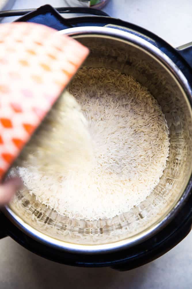Instant Pot Coconut Rice is the ONLY thing I make with curry these days! It's super easy and only a few ingredients! | PerrysPlate.com #instantpotrecipes #coconutrice Instant Pot Coconut Rice is the ONLY thing I make with curry these days! It's super easy and only a few ingredients! | PerrysPlate.com #instantpotrecipes #coconutrice