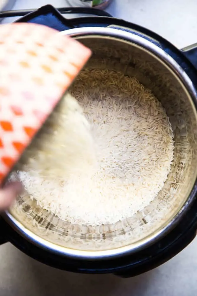 Instant Pot Coconut Rice is the ONLY thing I make with curry these days! It's super easy and only a few ingredients! | PerrysPlate.com #instantpotrecipes #coconutrice Instant Pot Coconut Rice is the ONLY thing I make with curry these days! It's super easy and only a few ingredients! | PerrysPlate.com #instantpotrecipes #coconutrice