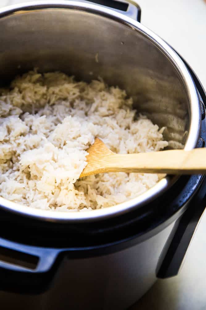 Instant Pot Coconut Rice is the ONLY thing I make with curry these days! It's super easy and only a few ingredients! | PerrysPlate.com #instantpotrecipes #coconutrice Instant Pot Coconut Rice is the ONLY thing I make with curry these days! It's super easy and only a few ingredients! | PerrysPlate.com #instantpotrecipes #coconutrice