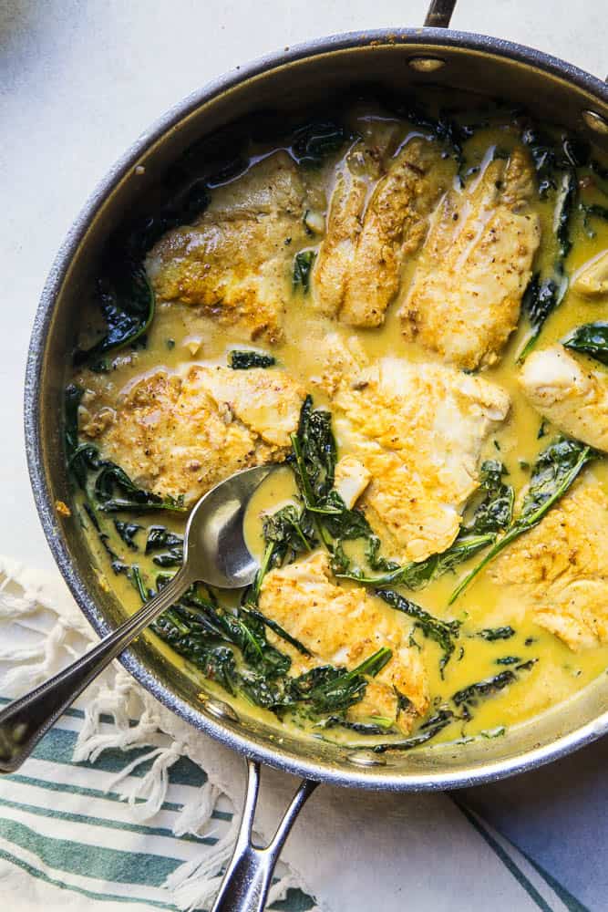 This one-pan Thai Coconut Fish Curry is a life-saver on a busy weeknight! Serve it up with some coconut rice (recipe link in the post!). | perrysplate.com #curryrecipe #thairecipes #weeknightdinnerrecipes