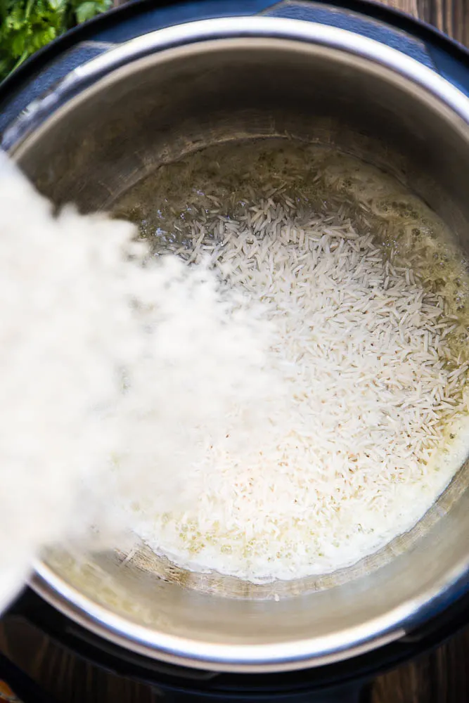 Add the rice to the Instant Pot | Instant Pot Cilantro Lime Rice recipe on PerrysPlate.com Add the rice to the Instant Pot | Instant Pot Cilantro Lime Rice recipe on PerrysPlate.com