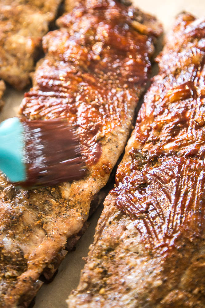 Making ribs in an Instant Pot is SO EASY! You get tender, sticky ribs in about an hour of cook time! Use your favorite BBQ sauce recipe, too! | perrysplate.com #instantpot #instantpotrecipes #ribs