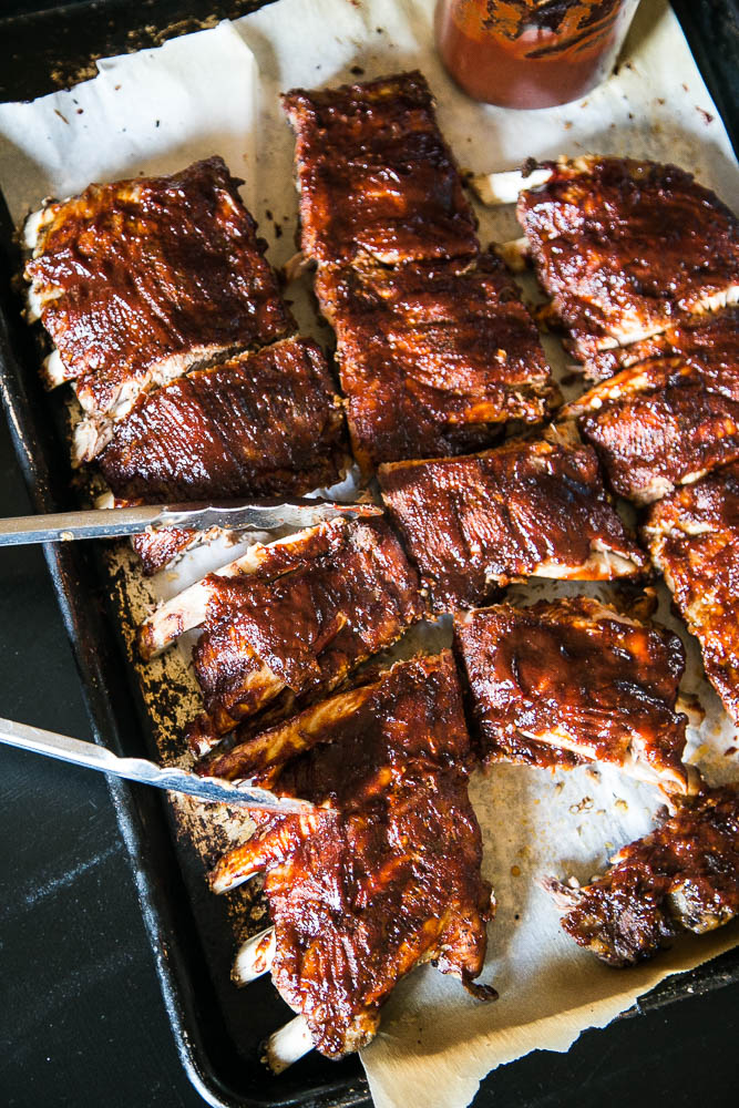 Making ribs in an Instant Pot is SO EASY! You get tender, sticky ribs in about an hour of cook time! Use your favorite BBQ sauce recipe, too! | perrysplate.com #instantpot #instantpotrecipes #ribs