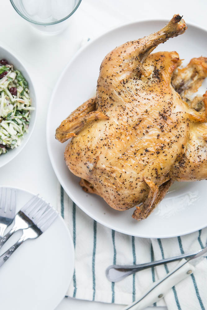 Does handling a whole chicken freak you out? Here's a tutorial that will show you step by step how easy it can be! | perrysplate.com #roastchicken #rotisseriechicken 