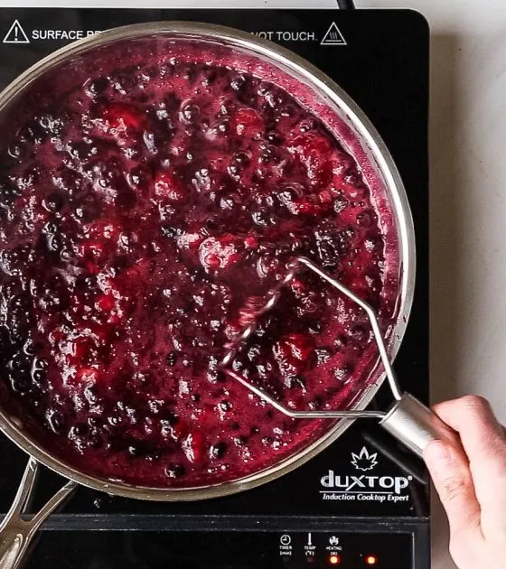 Keep a bag of frozen berries on hand to make this quick 3-ingredient sauce! Use it on crepes, waffles, pancakes, ice cream or over custard! | perrysplate.com #paleodessert #frozenberries #ketodessert