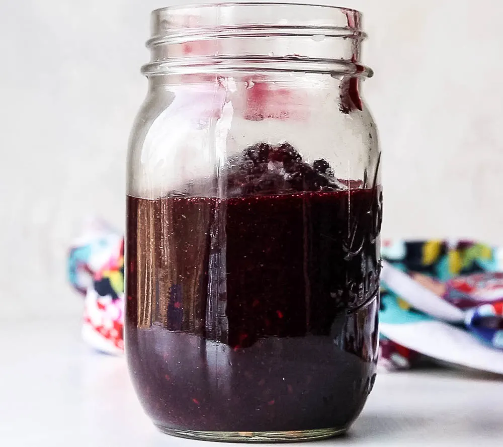 Keep a bag of frozen berries on hand to make this quick 3-ingredient sauce! Use it on crepes, waffles, pancakes, ice cream or over custard! | perrysplate.com #paleodessert #frozenberries #ketodessert