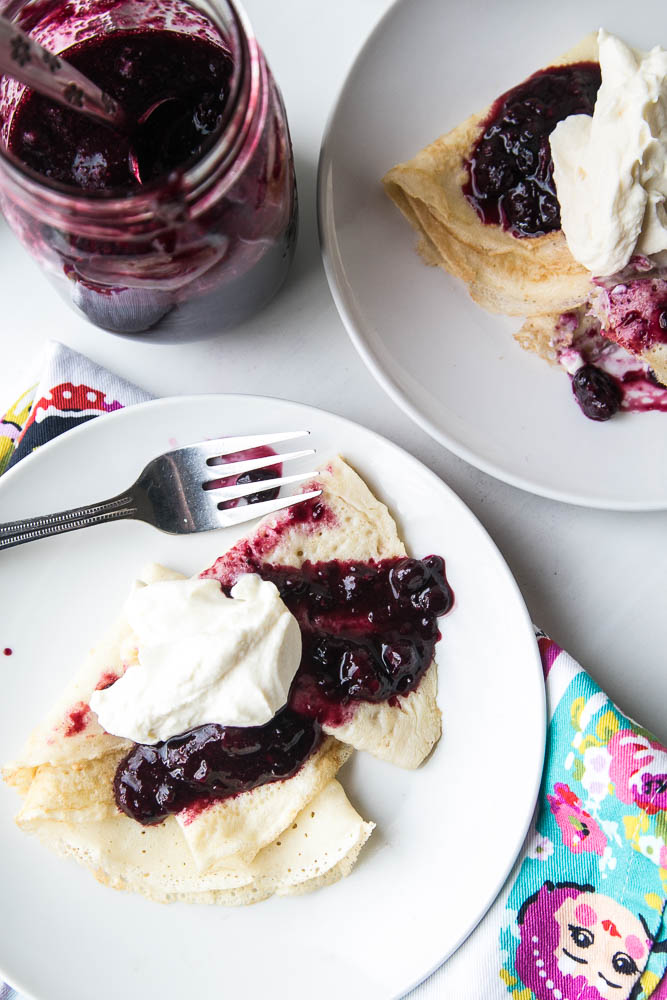 Keep a bag of frozen berries on hand to make this quick 3-ingredient sauce! Use it on crepes, waffles, pancakes, ice cream or over custard! | perrysplate.com #paleodessert #frozenberries #ketodessert