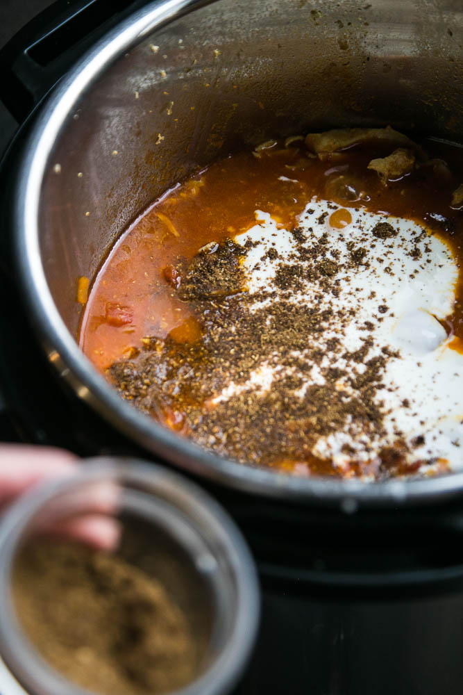 The secret to the amazing flavors in this Indian Curry is the yogurt and garam masala added at the end! It's super easy to make in the Instant Pot. You can make it dairy free by using coconut milk, too! | perrysplate.com #instantpot #instantpotrecipes #indianfood