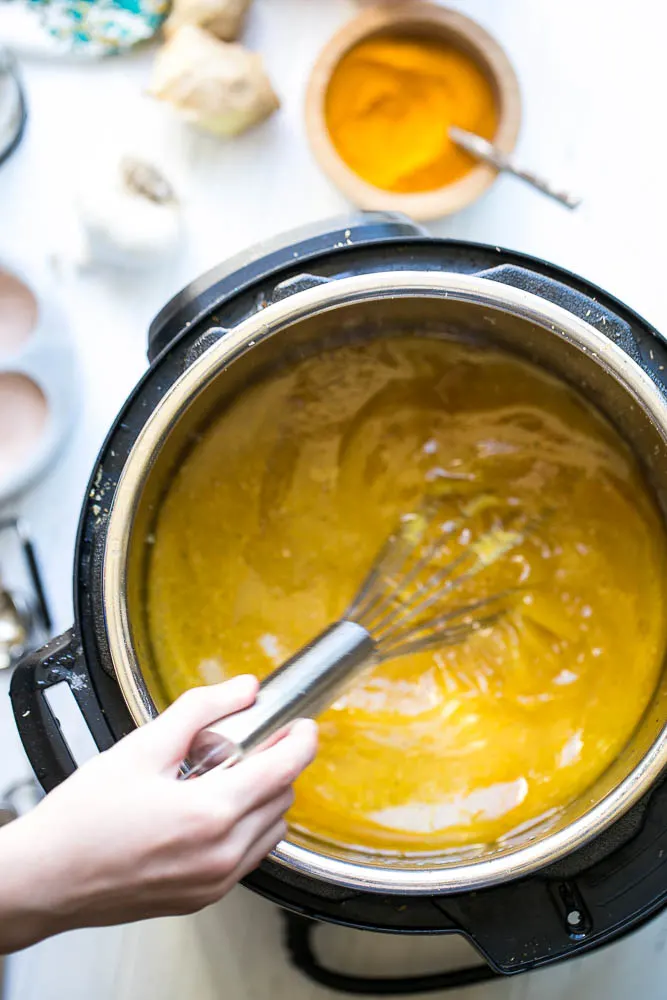 This flavorful bone broth has a handful of immunity-boosting ingredients and is perfect for sipping when you're sick. | perrysplate.com #bonebroth 