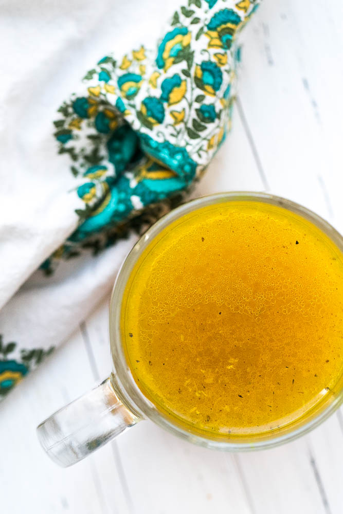 This flavorful bone broth has a handful of immunity-boosting ingredients and is perfect for sipping when you're sick. | perrysplate.com #bonebroth 