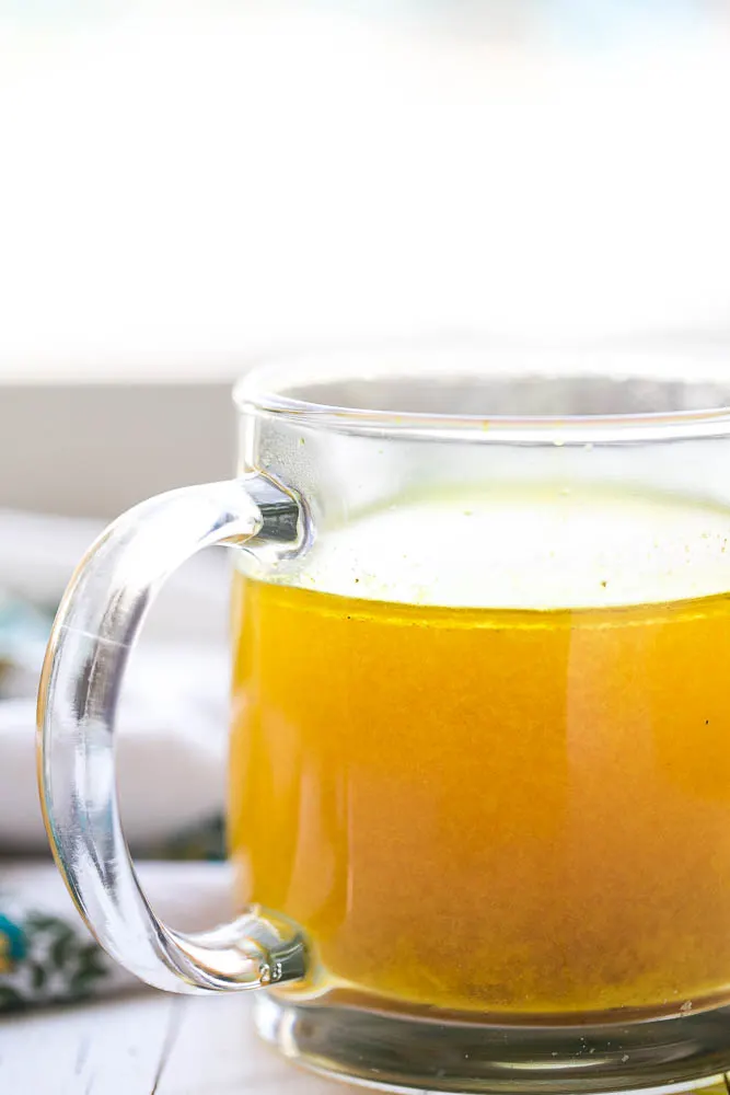 This flavorful bone broth has a handful of immunity-boosting ingredients and is perfect for sipping when you're sick. | perrysplate.com #bonebroth 