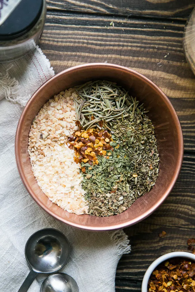 This isn't regular old Italian seasoning! It has an extra punch of garlic and heat. You'll never go back to the old version! | Perrysplate.com #italianseasoning The ingredients for homemade Italian seasoning are things you probably have on hand already.