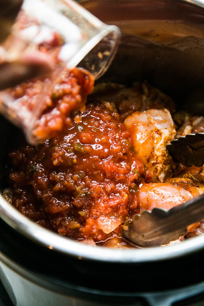 Making shredded chicken in your Instant Pot is the easiest thing ever! This recipe uses chipotle-spiked salsa to give it a smoky kick. | perrysplate.com #instantpot #instantpotrecipes