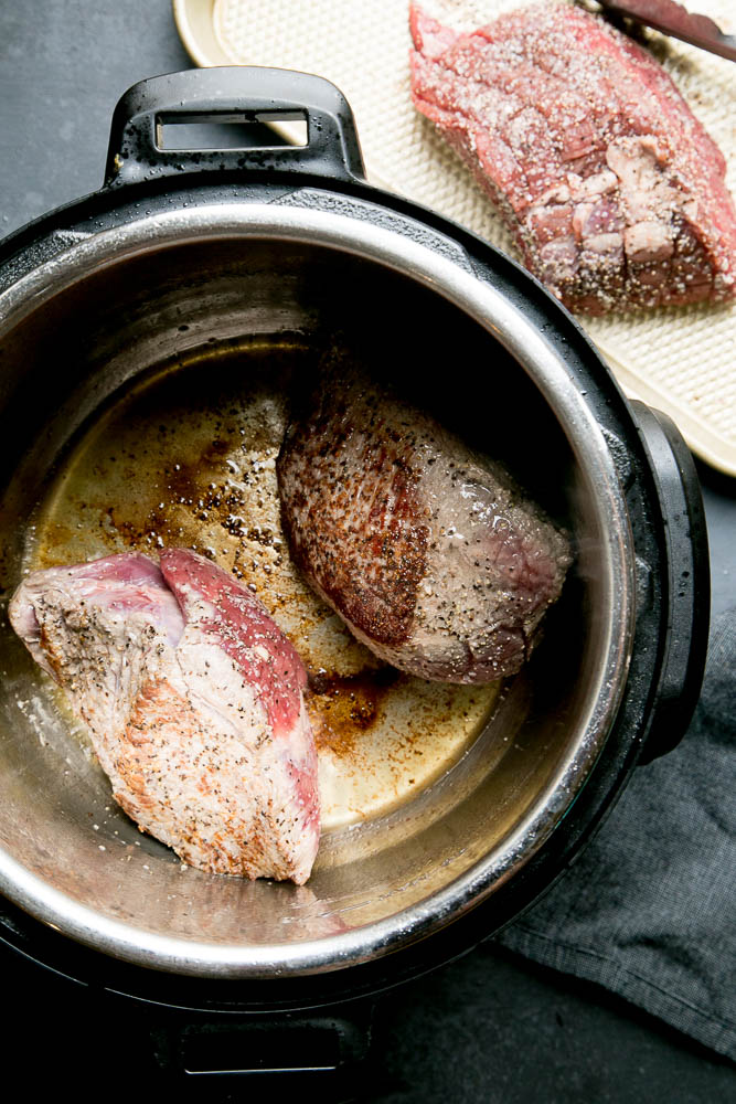 Sear the pieces of roast before cooking it in your Instant Pot.
