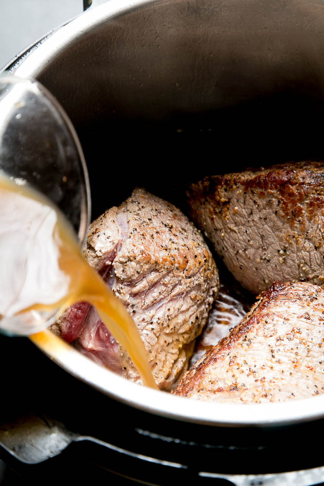 Sear the pieces of roast before cooking it in your Instant Pot.