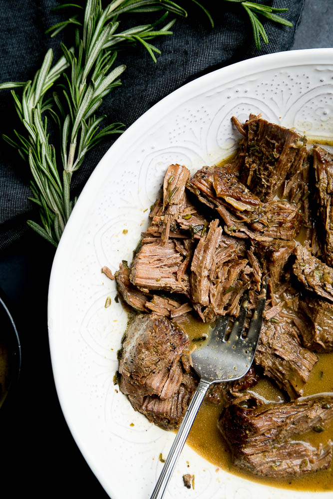 Instant Pot Pot Roast with Rosemary Gravy is an EASY weeknight meal, but special enough for company. Pair it with some mashed potatoes or roasted vegetables for a delicious meal.