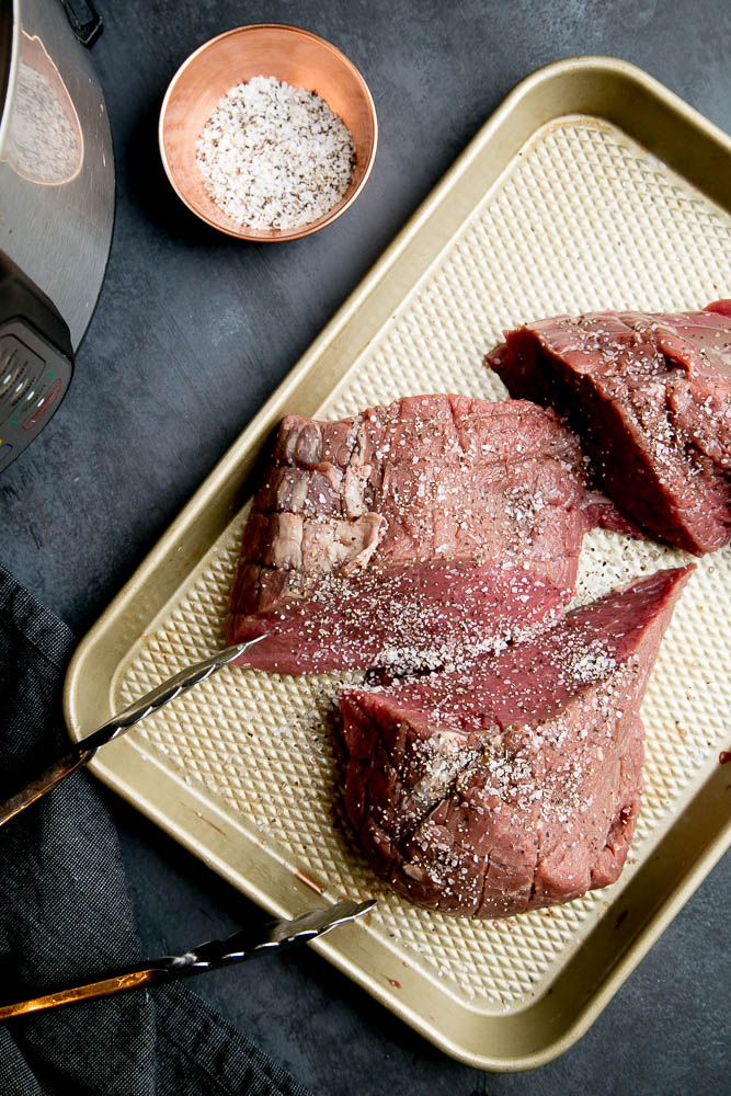 Cutting a roast into pieces helps it to cook more evenly and result in more tender meat in your Instant Pot.