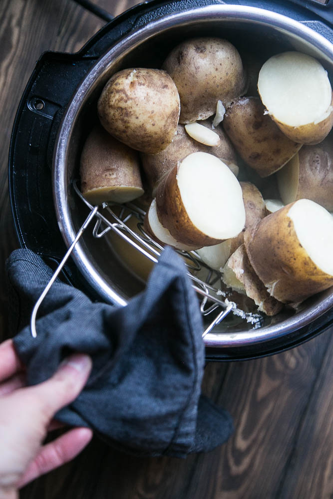 When the potatoes are finished cooking, remove the rack before mashing them. | Instant Pot Mashed Potatoes | perrysplate.com