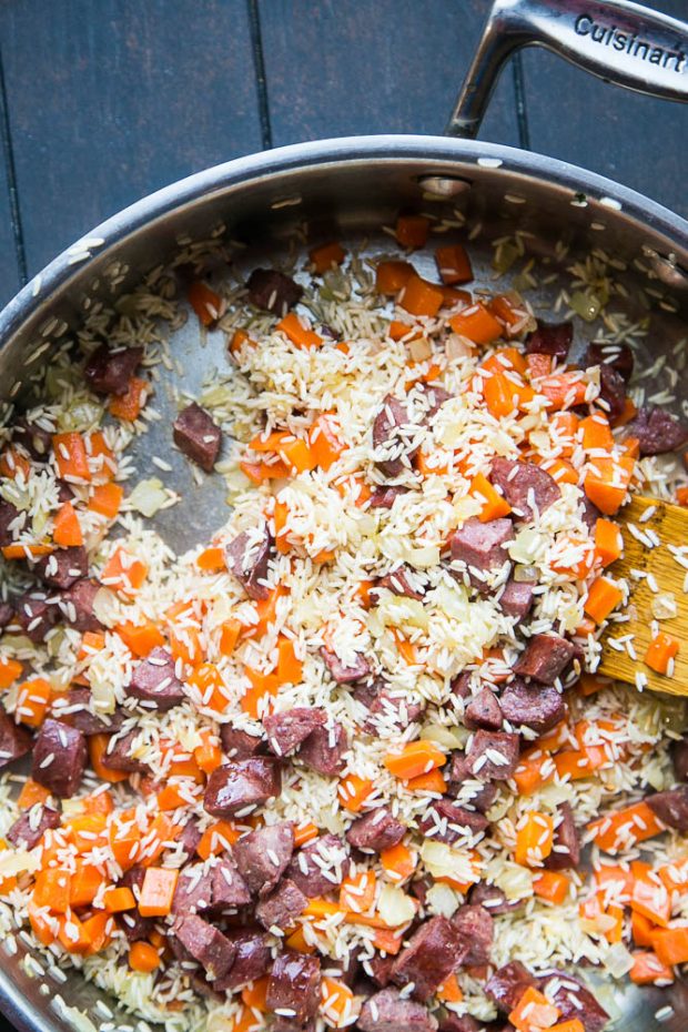 Easy Cajun Sausage & Rice Skillet -- made in about 30 minutes using only ONE PAN! Toasting the rice adds lots of flavor, too.