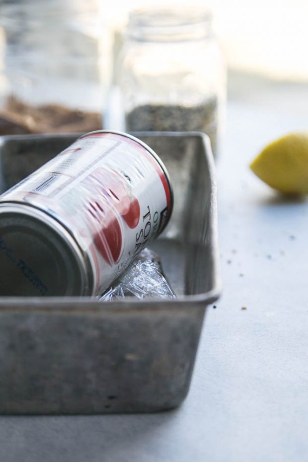 It's important to compress the salmon during curing -- I use a can of tomatoes.