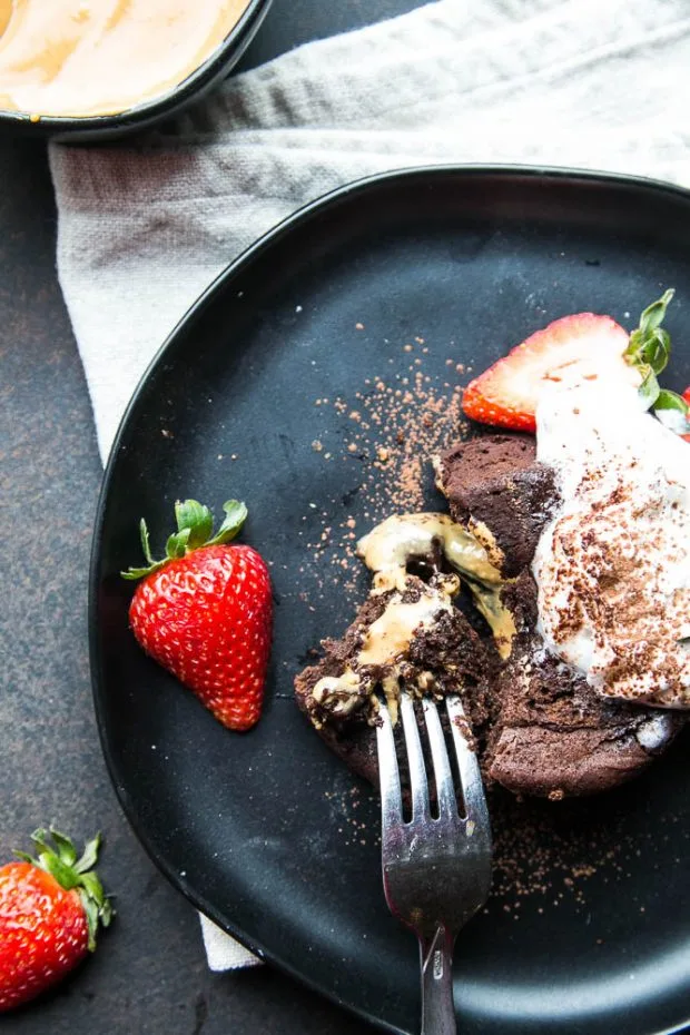 Garnish your chocolate lava cakes with whipped cream, cocoa powder, and fresh berries!