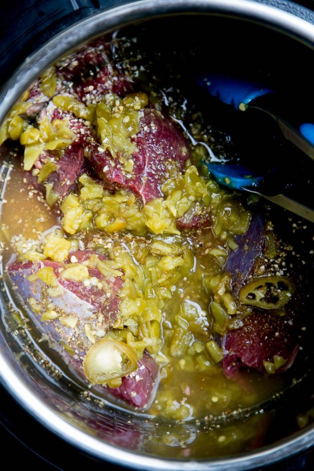 Instant Pot Shredded Beef is easy to make with hatch green chiles Prepping the green chile shredded beef in the instant pot.