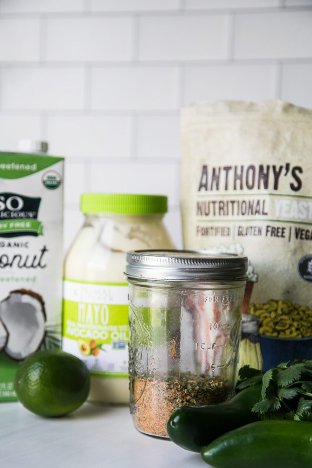 Ingredients for Roasted Jalapeno Ranch Dressing: dry ranch mix, avocado oil mayo, nutritional yeast, fresh cilantro, jalapenos, lime, and coconut milk. 
