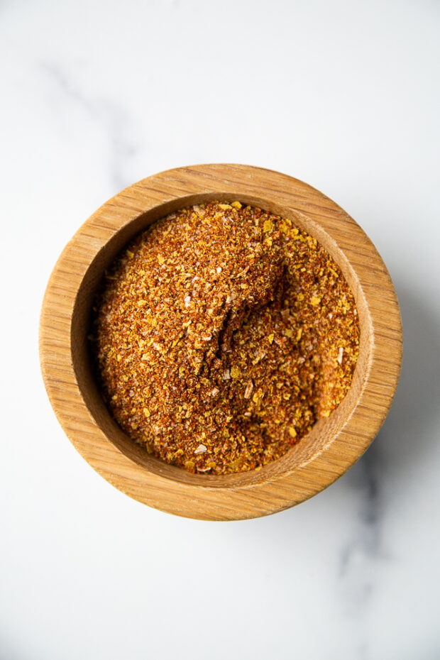 Homemade Smoky Chipotle Taco Seasoning in a small wooden bowl.