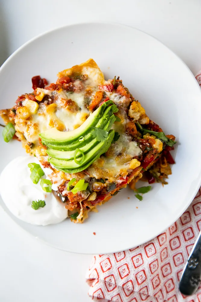 Slice of Stacked Roasted Vegetable Enchiladas Slice of Stacked Roasted Vegetable Enchiladas