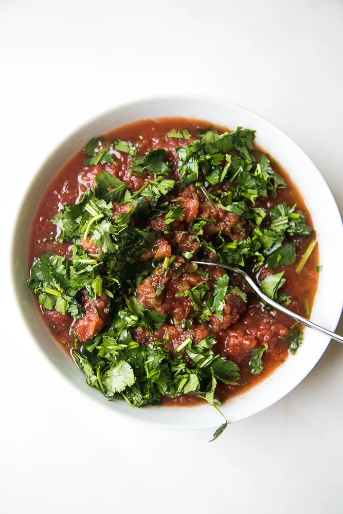 Fresh salsa mixed with fresh cilantro Fresh salsa mixed with fresh cilantro