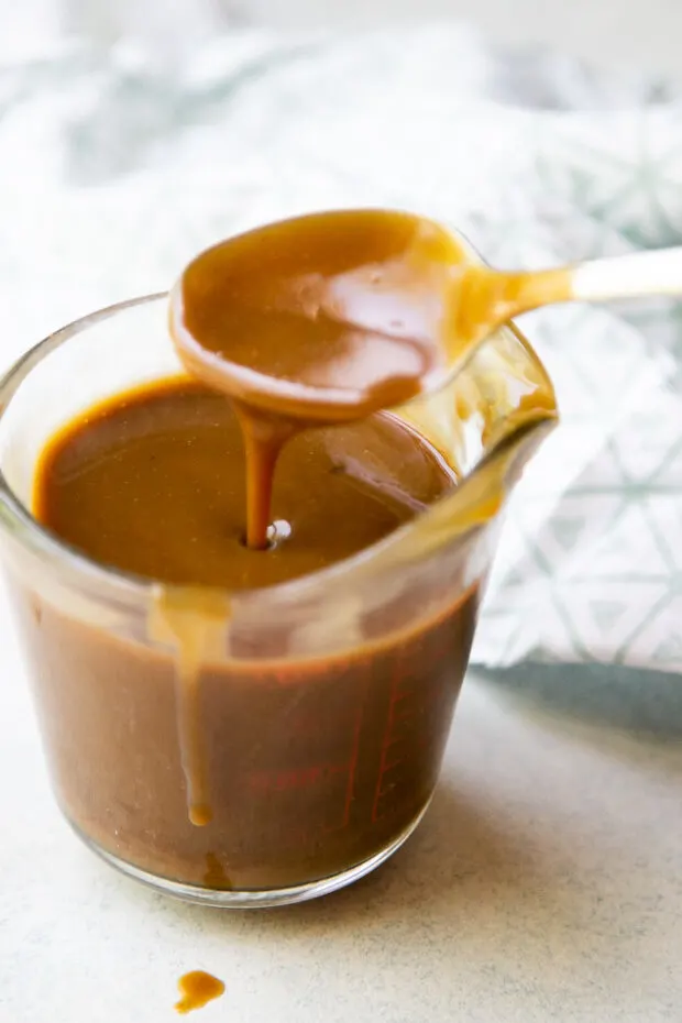 Coconut Caramel sauce in a liquid measuring cup