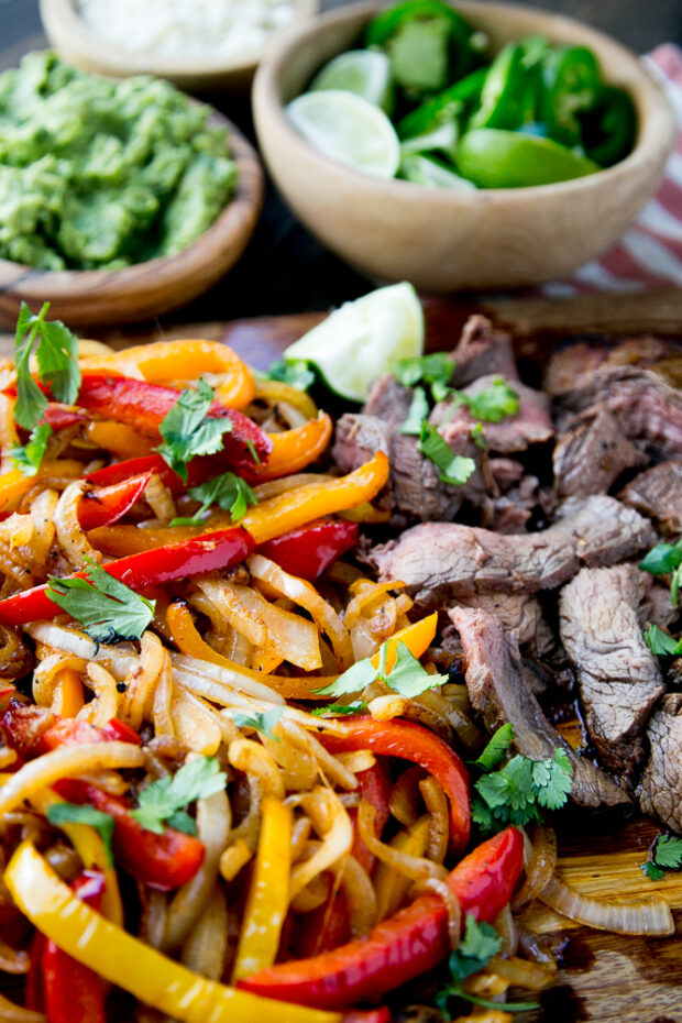 Marinated Grilled Steak Fajitas with caramelized peppers & onions -- the best steak fajita marinade!